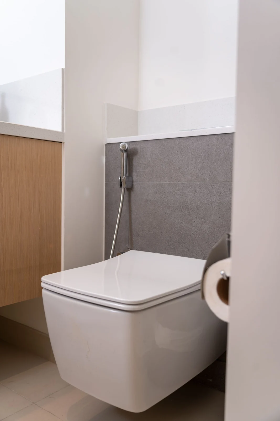 Wall-hung toilet in a tiled bathroom