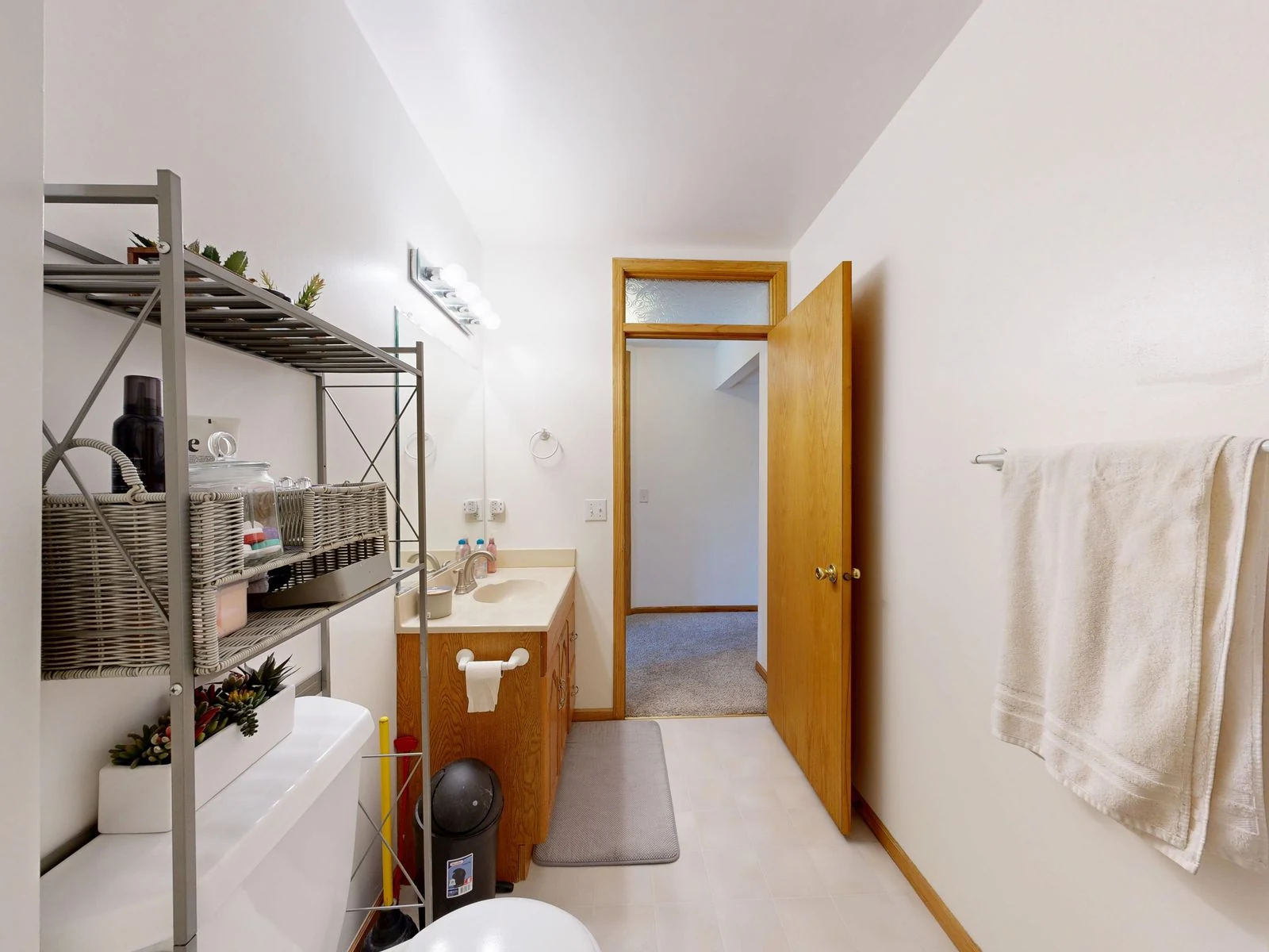 Open bathroom shelves and towel storage