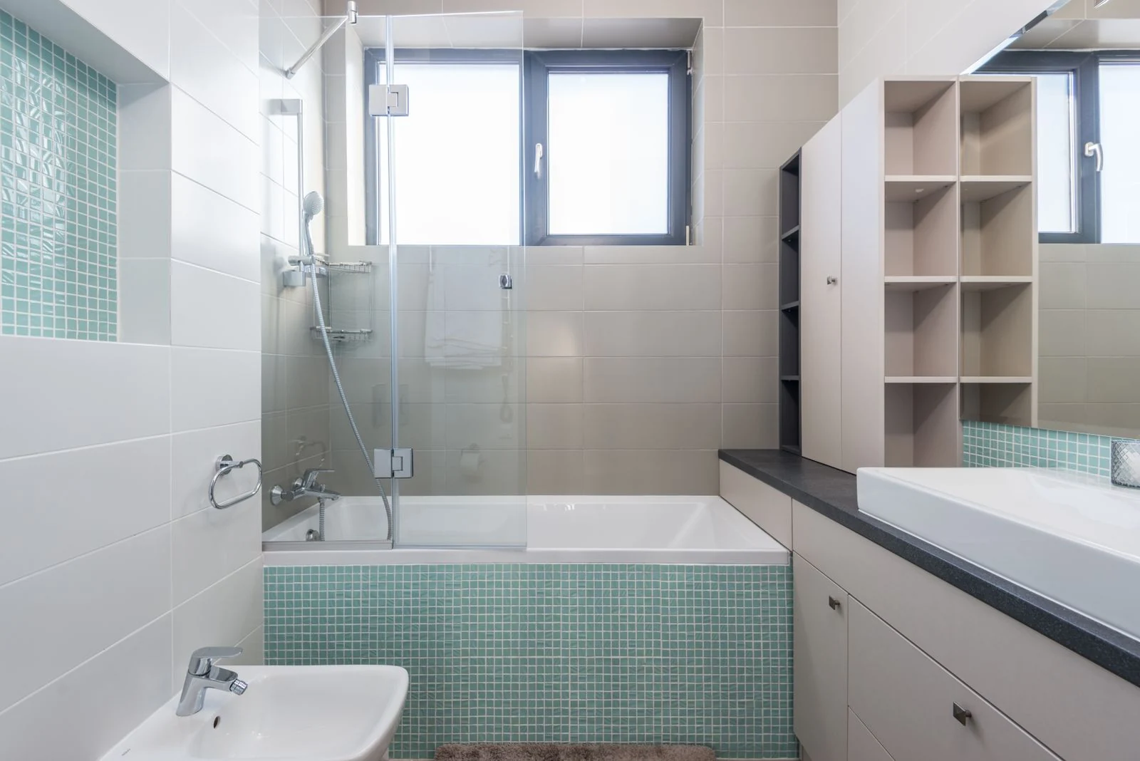 A sleek and contemporary bathroom featuring minimalist design and modern amenities
