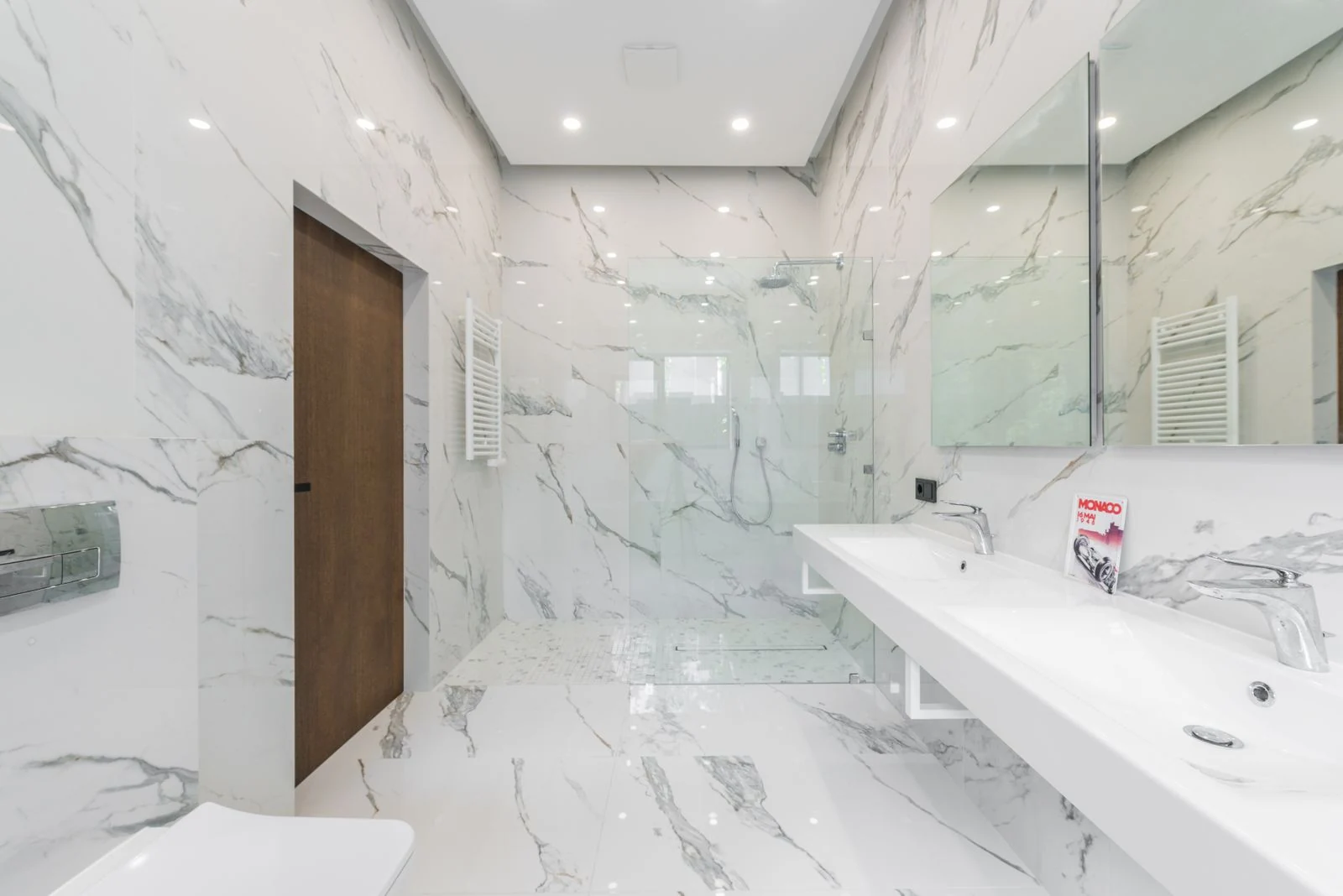 Elegant white marble bathroom with modern fixtures and minimalist design elements